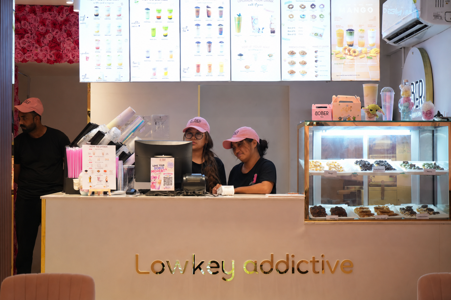 Bober Tea team members serving customers behind the café counter
